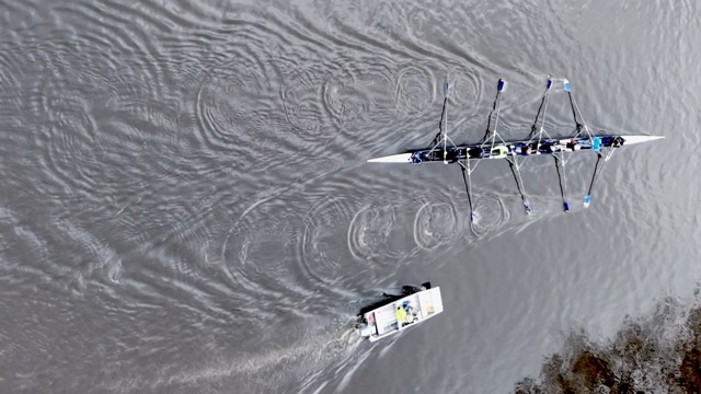 An eight from above, with the coach launch alongside